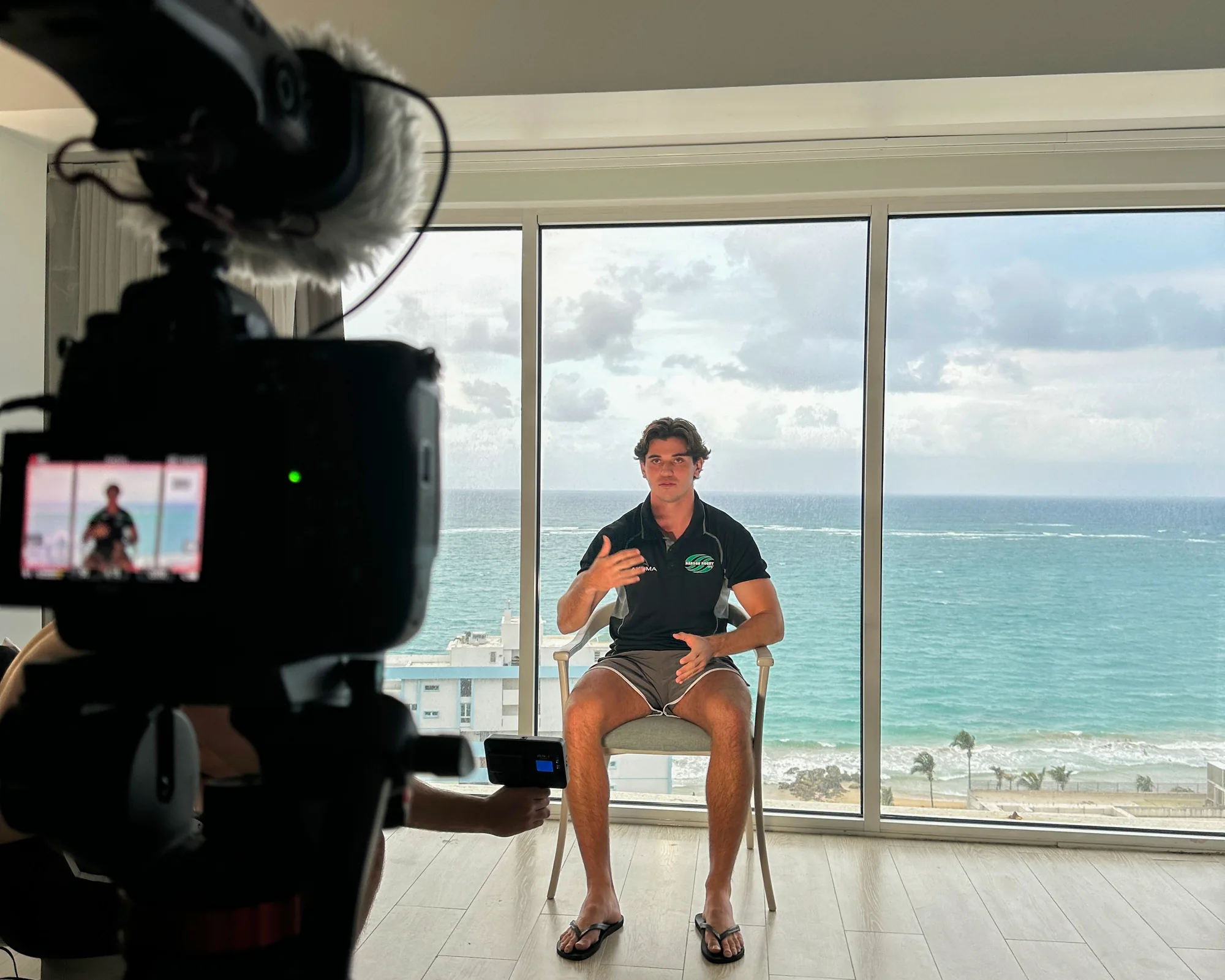 Camera setup framing an oceanfront interview during a Soule Media production.
