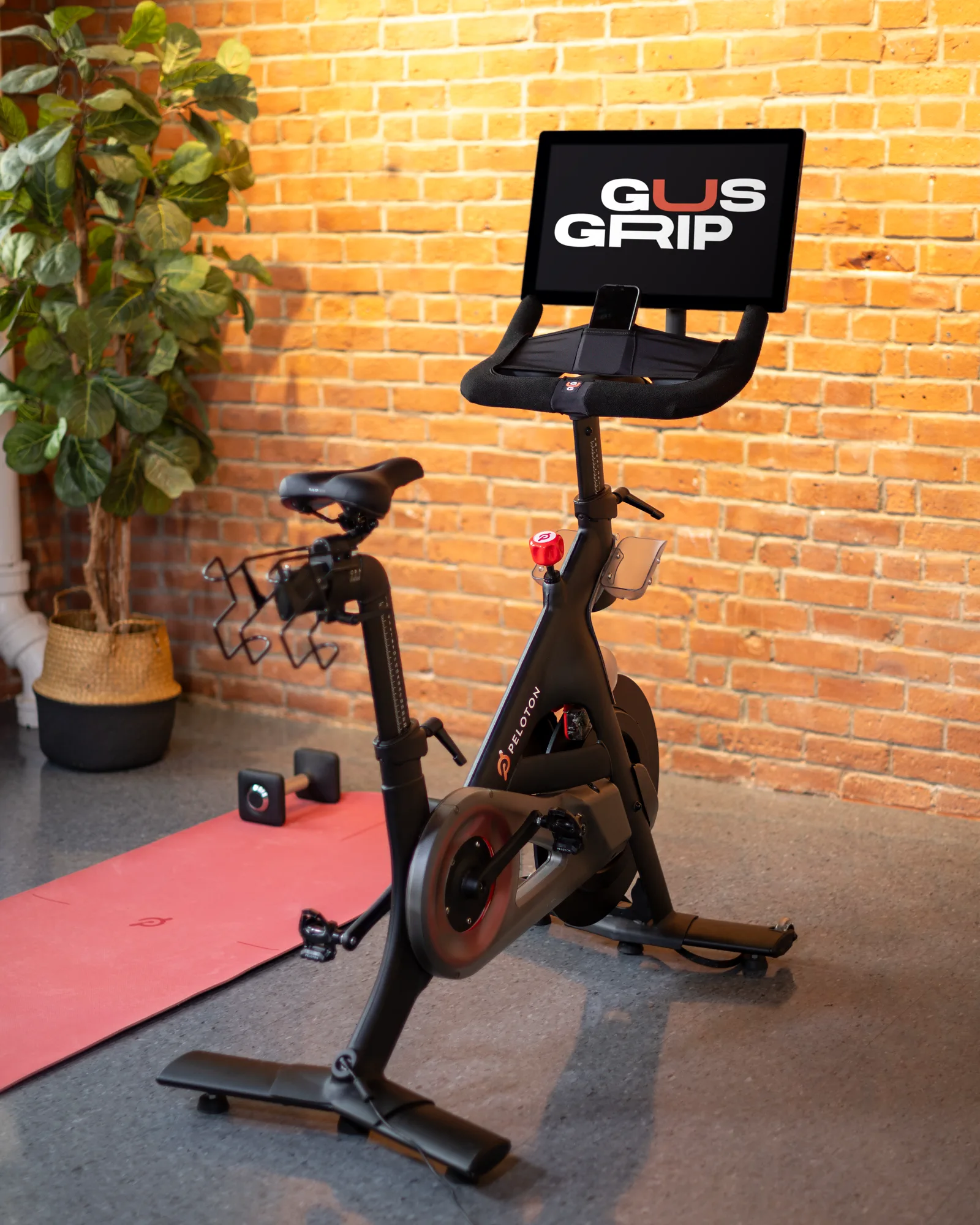 Indoor cycling machine shown with the Gus Grips cover wrapped around its handlebars.