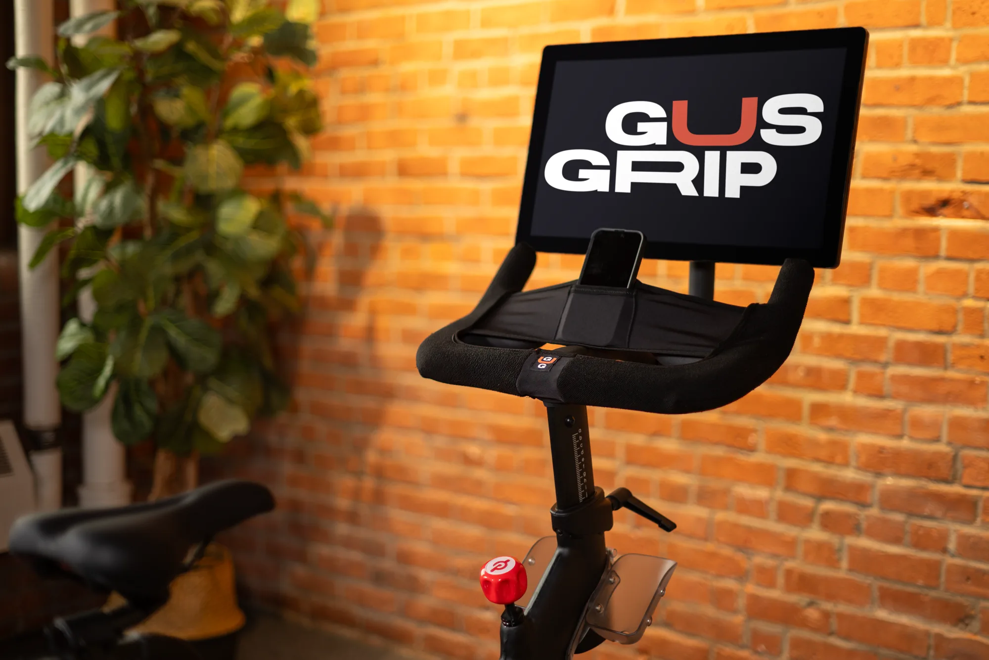 Three-quarter view of the Gus Grips cover installed around indoor cycling handlebars.