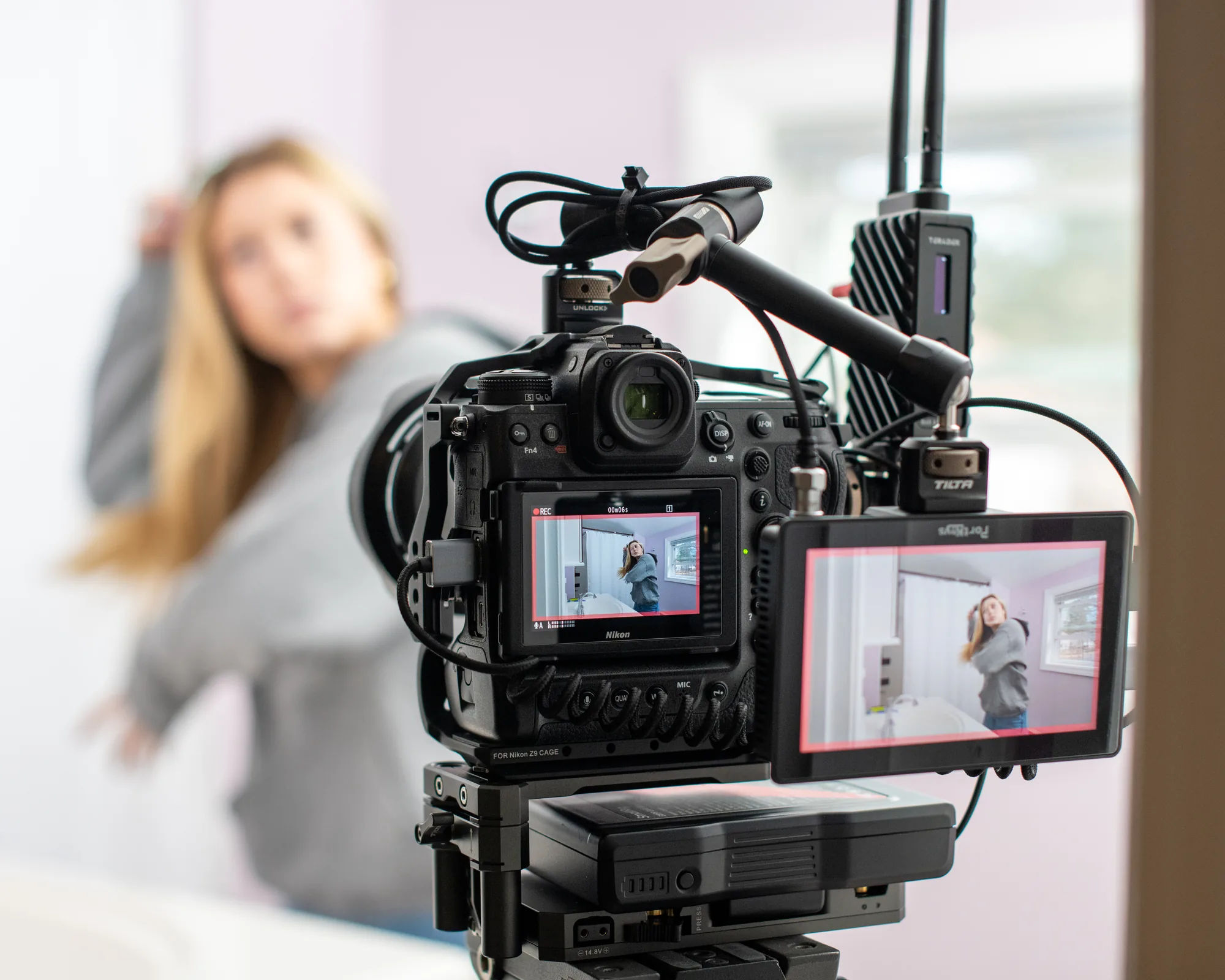 Cinema camera framing a performer during the Scholar Suites production.