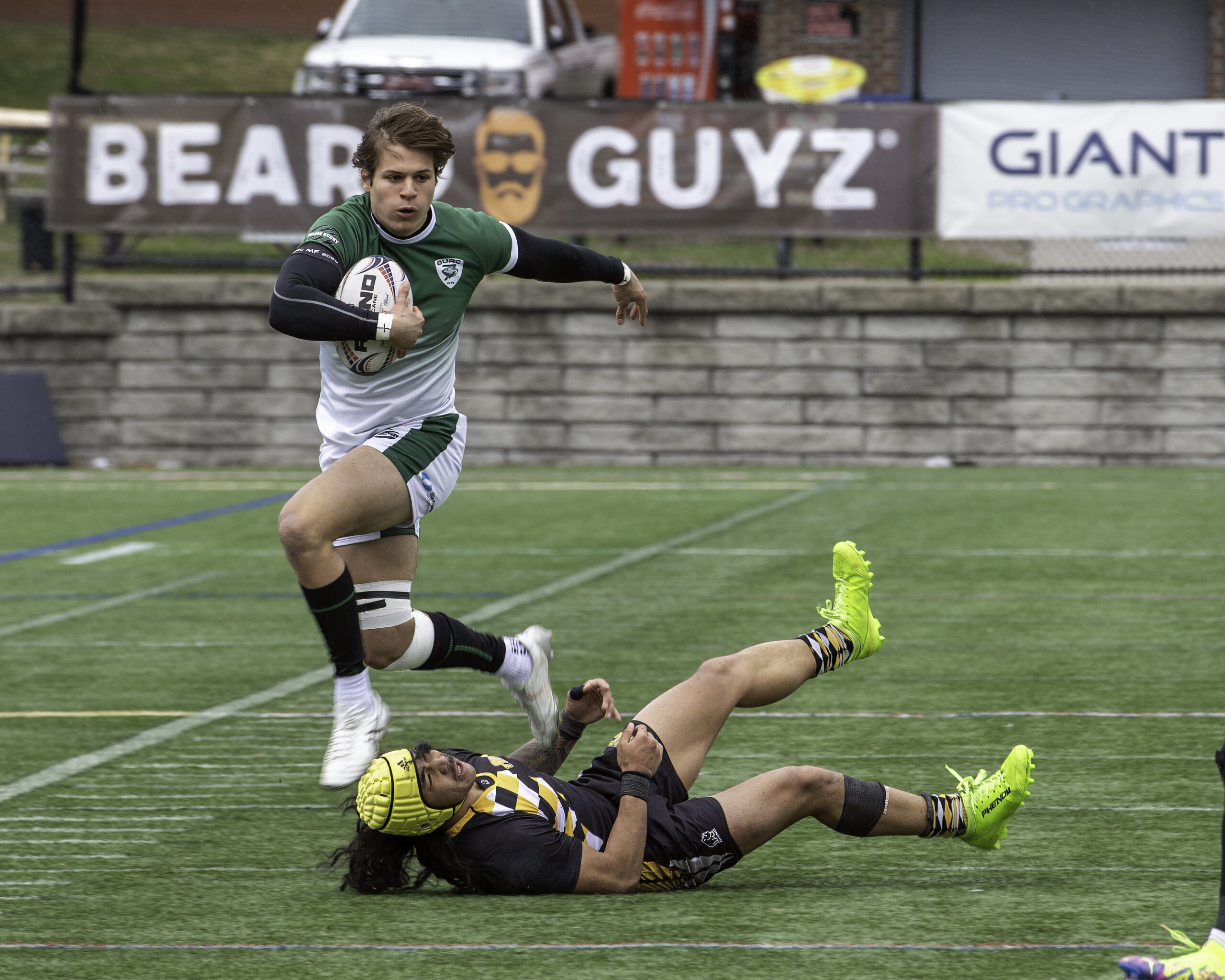 a man in a uniform running towards a man in a helmet